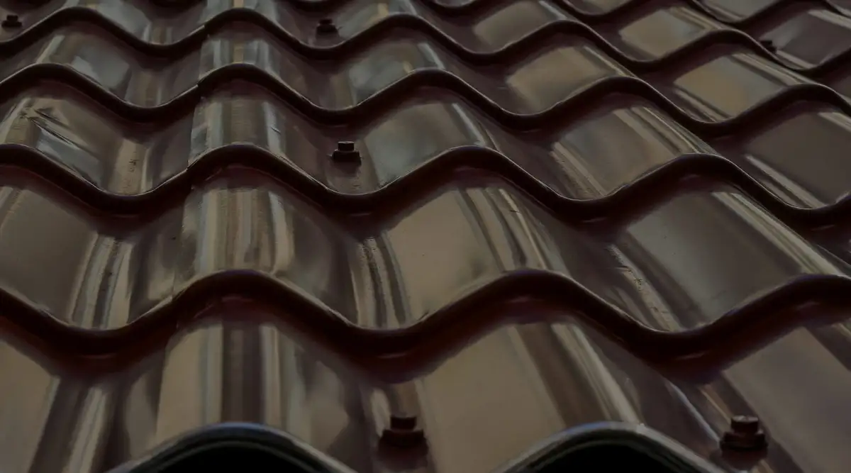 Trudel & Sons roofer inspecting a roof